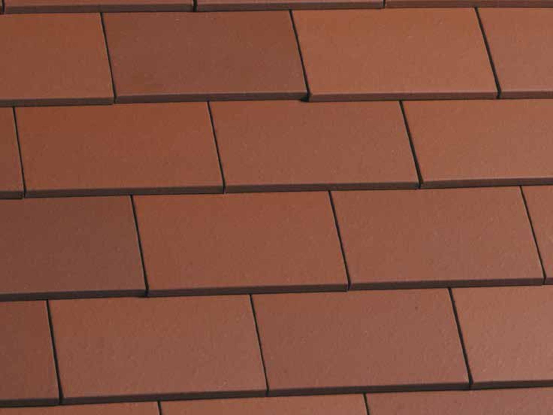 Reusable clay tiles are a modern and lower carbon interpretation of the brick used locally.